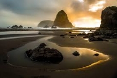 Southern Oregon misty beach at dusk | Walking distance for guests staying at Ocean Suites Motel, Brookings Oregon